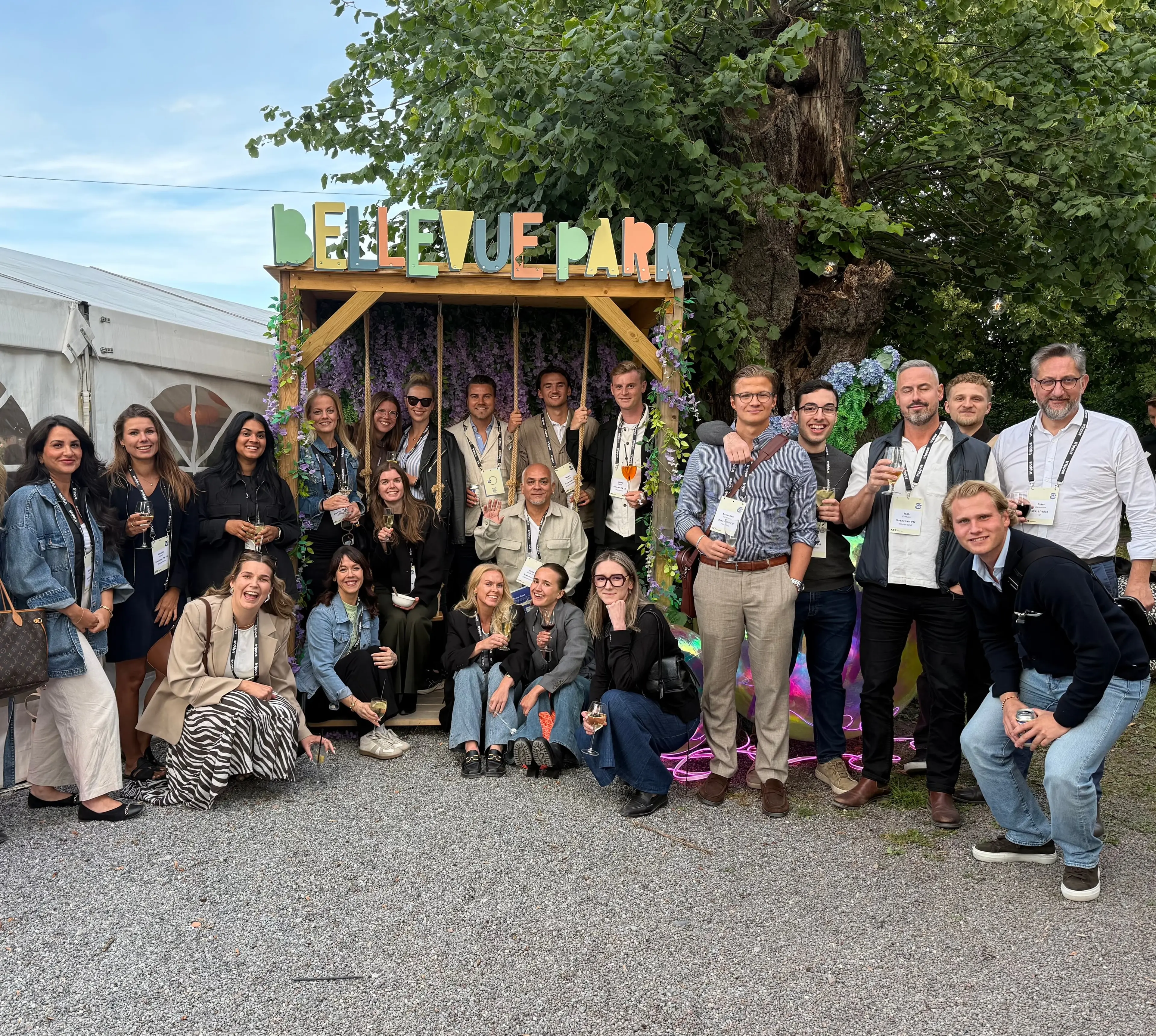 Colleagues from Sveaviken PM gathered by the sign in Bellevue Park
